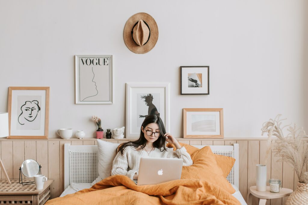 a woman researching propane tank installation costs on her laptop in bed